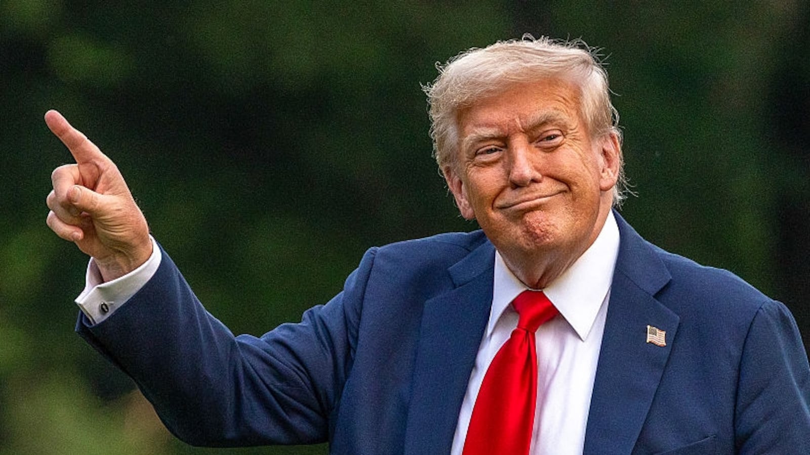 WASHINGTON, DC - JULY 13: U.S. President Donald Trump walks on the south lawn of the White House and points up at the new flag on July 13, 2025 in Washington, DC. President Trump and first lady Melania Trump spend the afternoon attending the final match of the FIFA Club World Cup at MetLife Stadium in East Rutherford, New Jersey. (Photo by Tasos Katopodis/Getty Images)