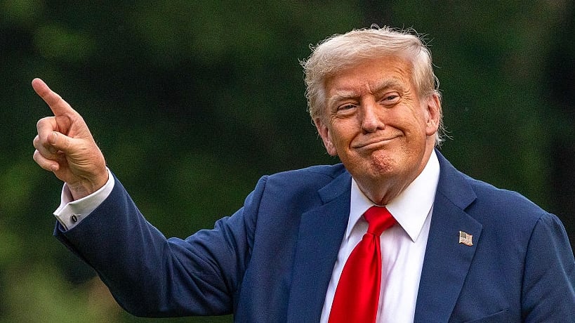 WASHINGTON, DC - JULY 13: U.S. President Donald Trump walks on the south lawn of the White House and points up at the new flag on July 13, 2025 in Washington, DC. President Trump and first lady Melania Trump spend the afternoon attending the final match of the FIFA Club World Cup at MetLife Stadium in East Rutherford, New Jersey. (Photo by Tasos Katopodis/Getty Images)
