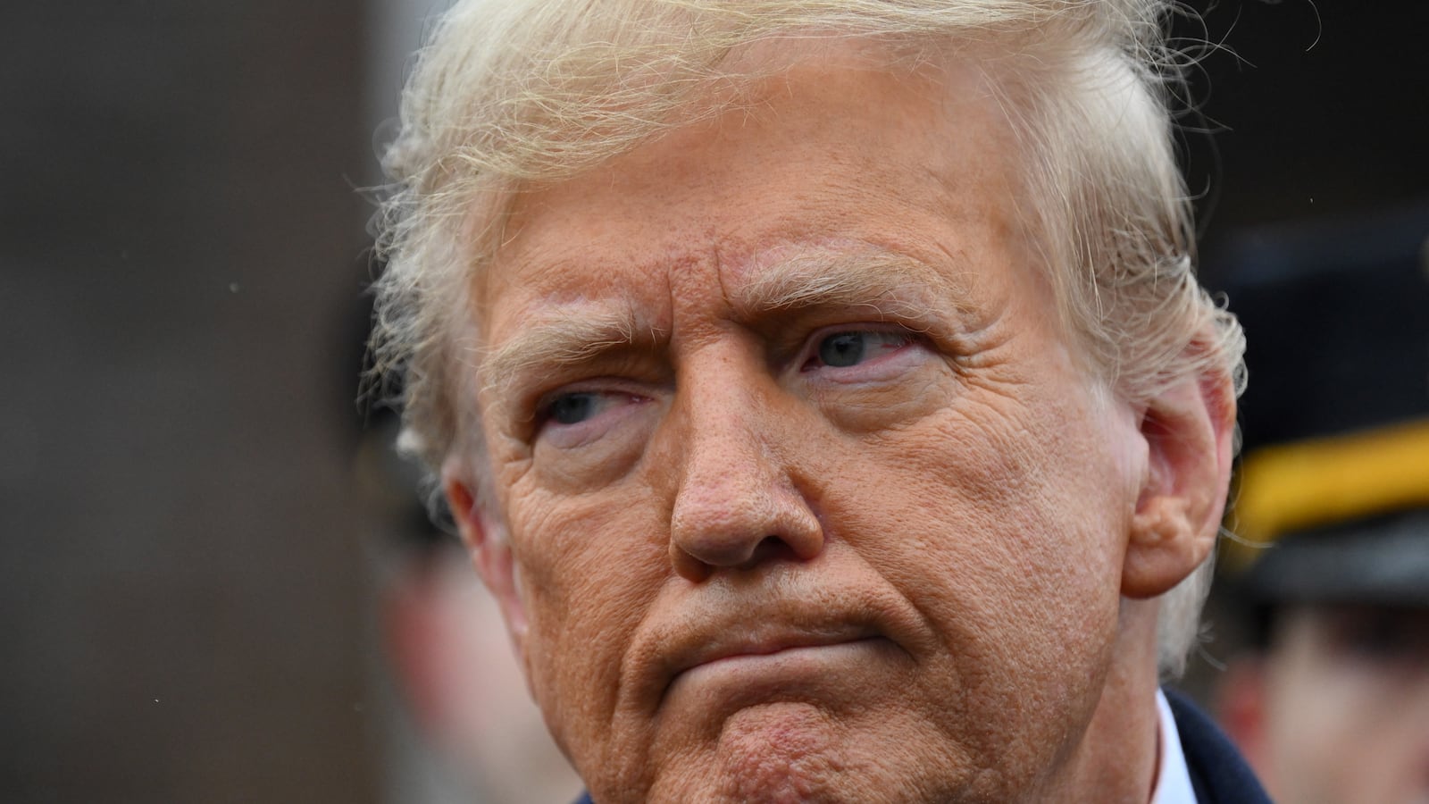 Former US President Donald Trump speaks to the press after attending the wake for New York Police Department (NYPD) Officer Jonathan Diller in Massapequa, Long Island, New York, on March 28, 2024.