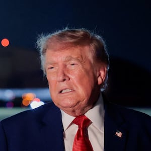 U.S. President Donald Trump speaks to members of the media after disembarking Air Force One at Joint Base Andrews, Maryland, U.S., August 11, 2026.