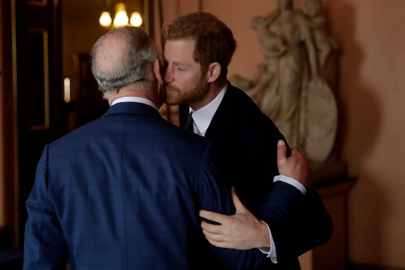 Prince Harry and his father, Prince Charles, arrive to attend the 'International Year of The Reef' meeting at Fishmongers Hall in London on February 14, 2018.