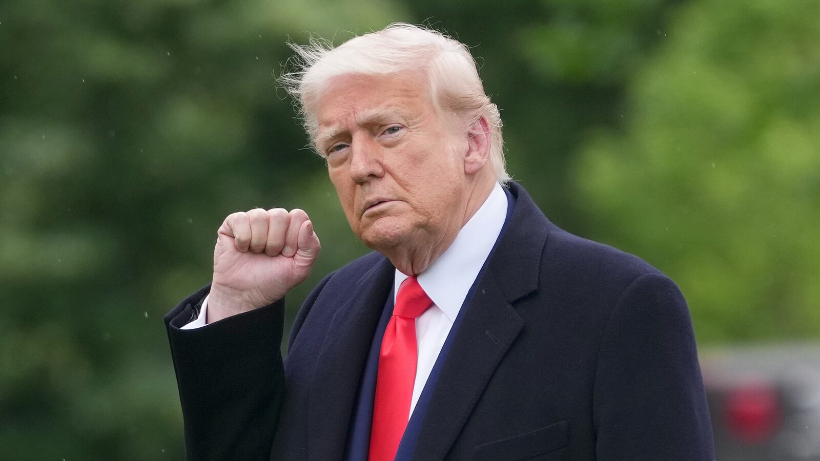Donald Trump pumps his fist as he leaves the White House on May 22.