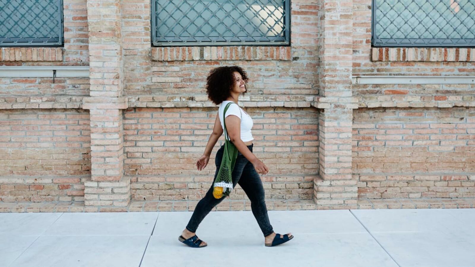 Photo: A woman walking down the street.