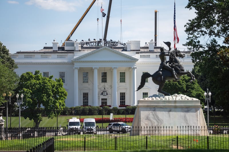 The White House is viewed through the fenced-off Lafayette Square during ongoing renovations in Washington, D.C., U.S., June 21, 2026. REUTERS/Aaron Schwartz