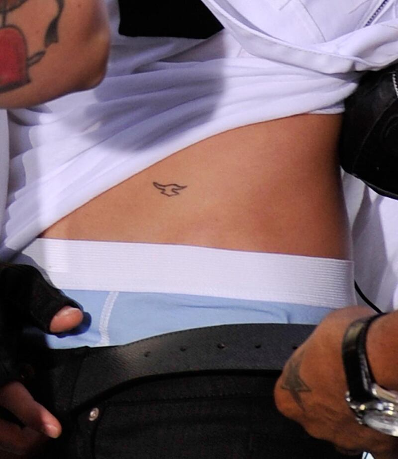 galleries/2013/05/02/justin-bieber-s-tattoos-a-selena-gomez-look-a-like-a-crown-jesus-ink-and-more/130429-justin-bieber-tattoos1_t3bujt