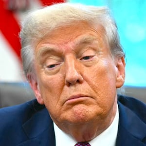 Donald Trump speaks to reporters after signing executive orders in the Oval Office of the White House in Washington, DC on September 5, 2025. )