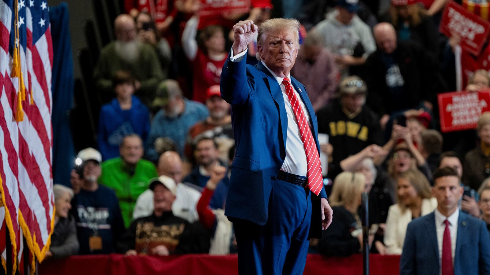 Former U.S. President and Republican presidential candidate Donald Trump gestures as he attends a campaign event, in Clinton, Iowa