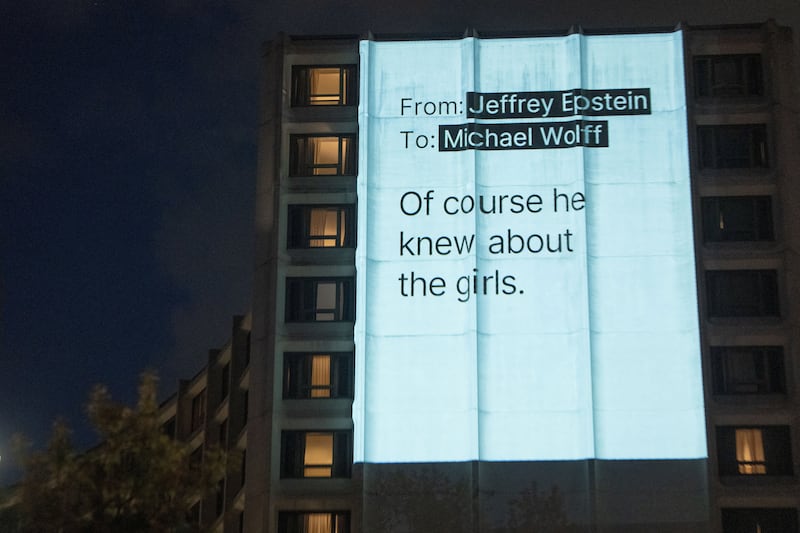 A projection related to the late financier and convicted sex offender Jeffrey Epstein's case is projected onto the Washington Hilton in Washington, D.C., U.S., April 24, 2026. REUTERS/Aaron Schwartz