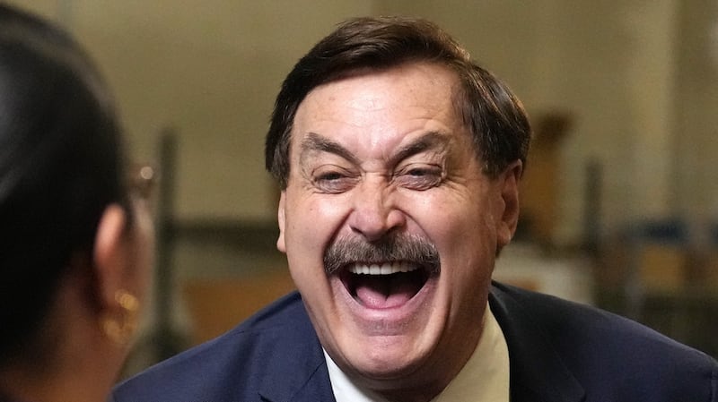 My Pillow founder and CEO Mike Lindell laughs as he greets reporters while announcing his run for Governor of Minnesota to a camera streaming to LindellTV Thursday, Dec. 11, 2025 at his company's warehouse in Shakopee, Minn.  ] ANTHONY SOUFFLE • anthony.souffle@startribune.com