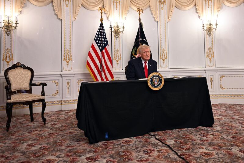 US President Donald Trump participates in a video call with military service members from his Mar-a-Lago residence in Palm Beach, Florida, on November 27, 2025, during the Thanksgiving holiday.
