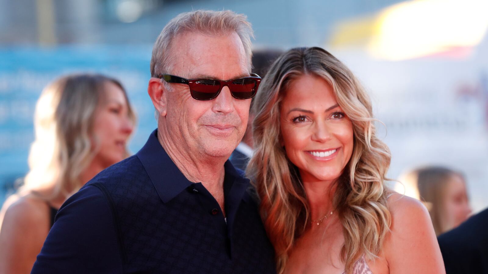 Cast member Kevin Costner and his wife Christine Baumgartner pose at the premiere for the film “The Art of Racing in the Rain” in Los Angeles, California, U.S., August 1, 2019.