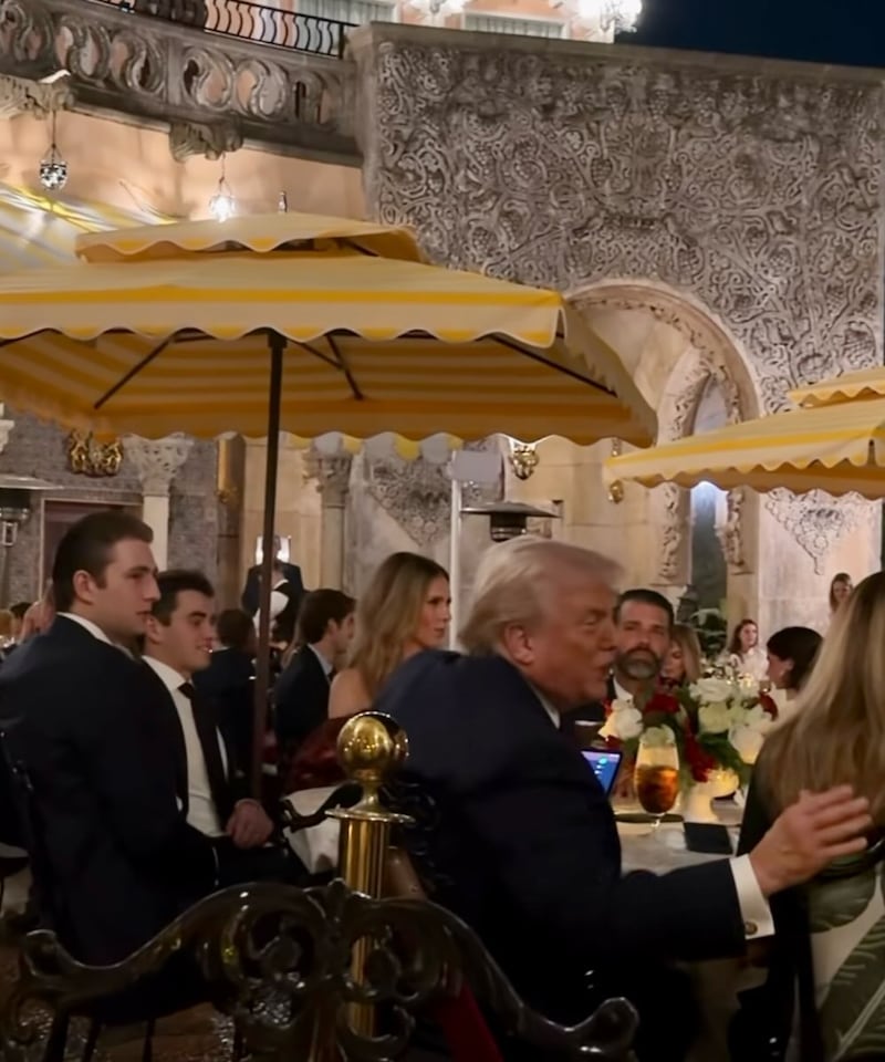 Barron Trump is spotted in the background of footage taken at the Mar-a-Lago Christmas Day dinner.