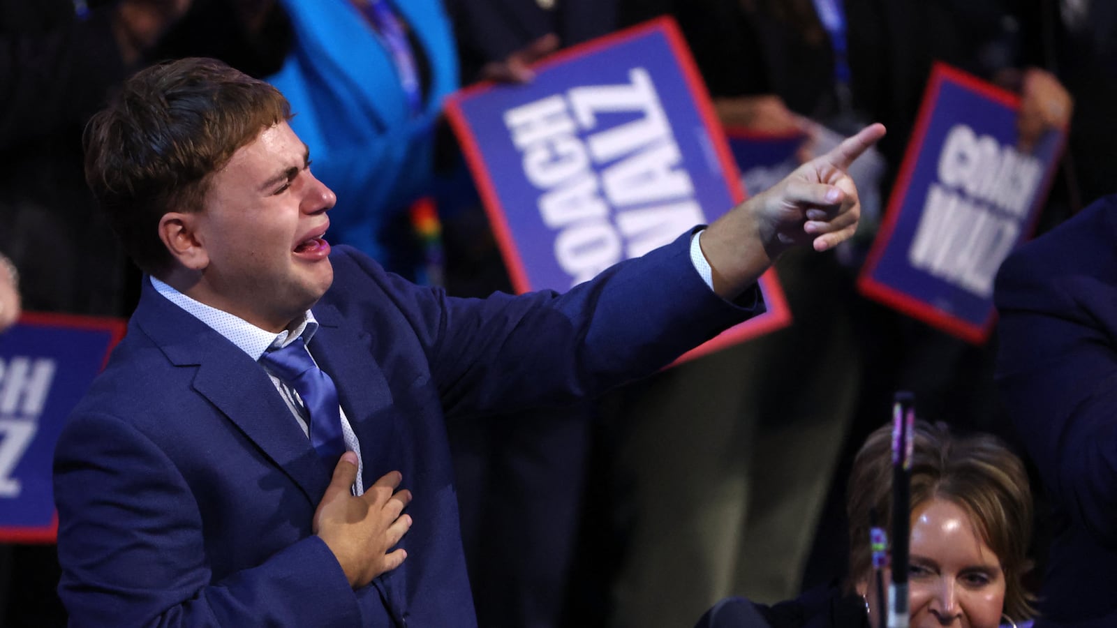 Gus Walz, cries and cheers during his father, Tim Walz's speech at the Democratic National Convention on Aug. 21.