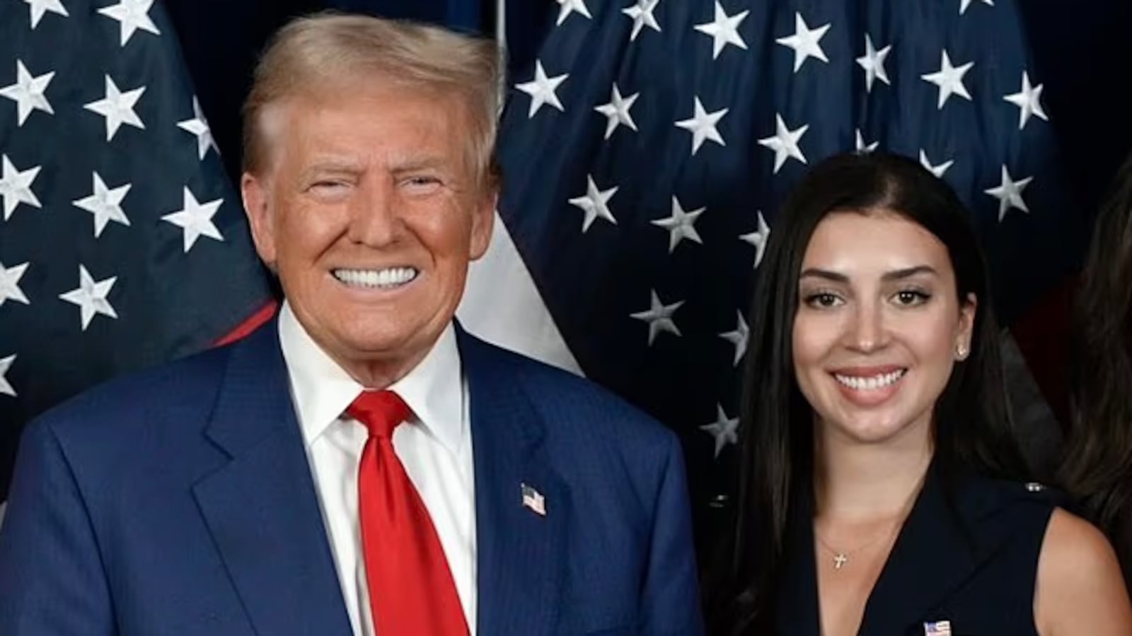 A photo of Julia Varvaro posing with Donald Trump.