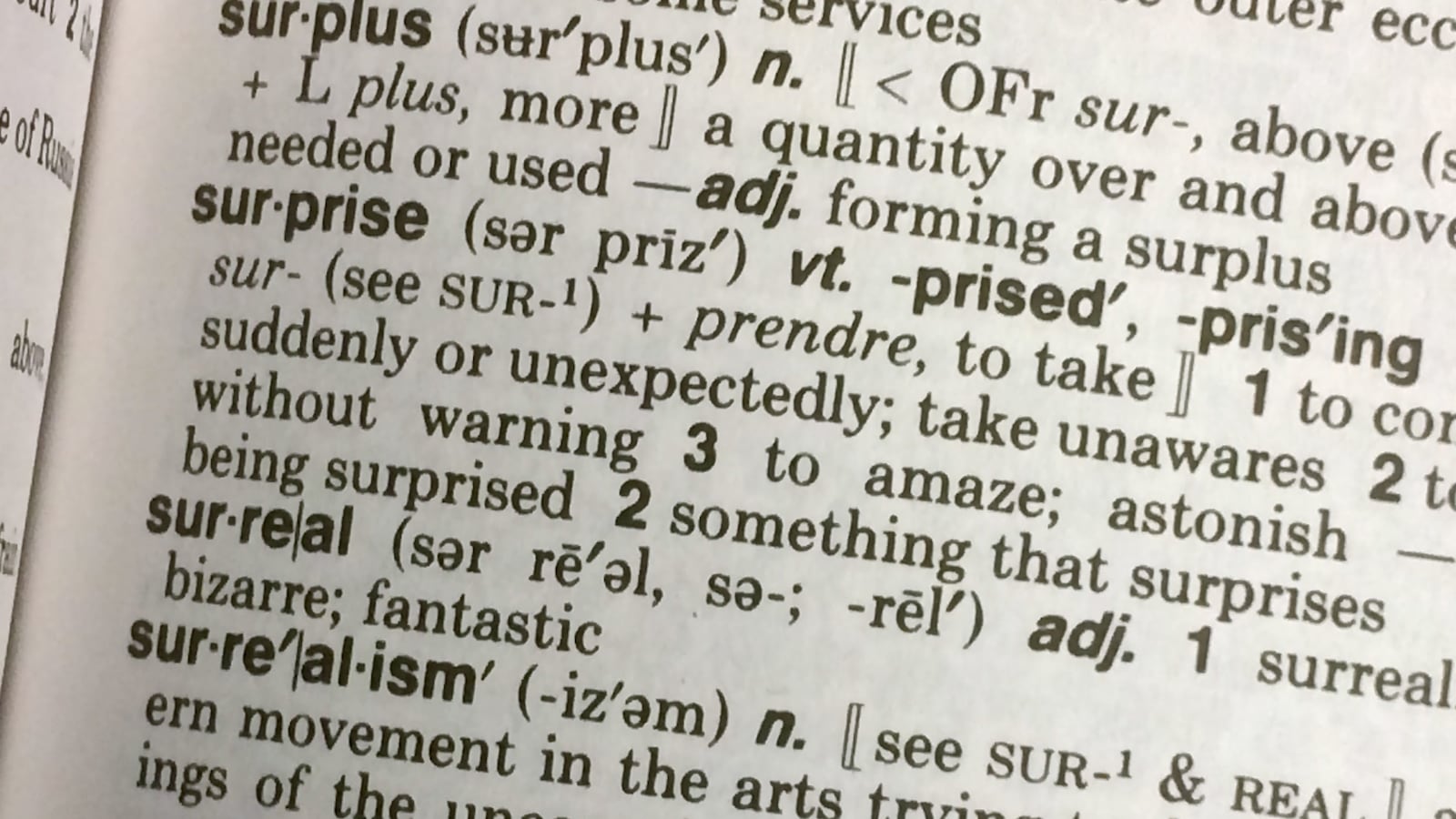 This Dec. 16, 2016, photo illustration taken in Washington, D.C., shows the definition for the word “Surreal” in a copy of the Webster’s Desktop Dictionary.