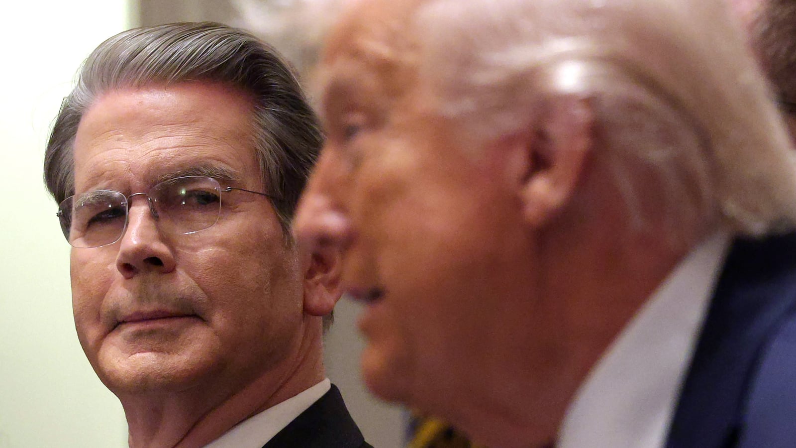 WASHINGTON, DC - DECEMBER 08: U.S. Treasury Secretary Scott Bessent looks on as U.S. President Donald Trump delivers remarks during a roundtable discussion with farmers in the Cabinet Room of the White House on December 08, 2025 in Washington, DC. President Trump is expected to announce a $12 billion farm aid package, which includes one-time payments to those affected by the administration’s trade policies. (Photo by Alex Wong/Getty Images)