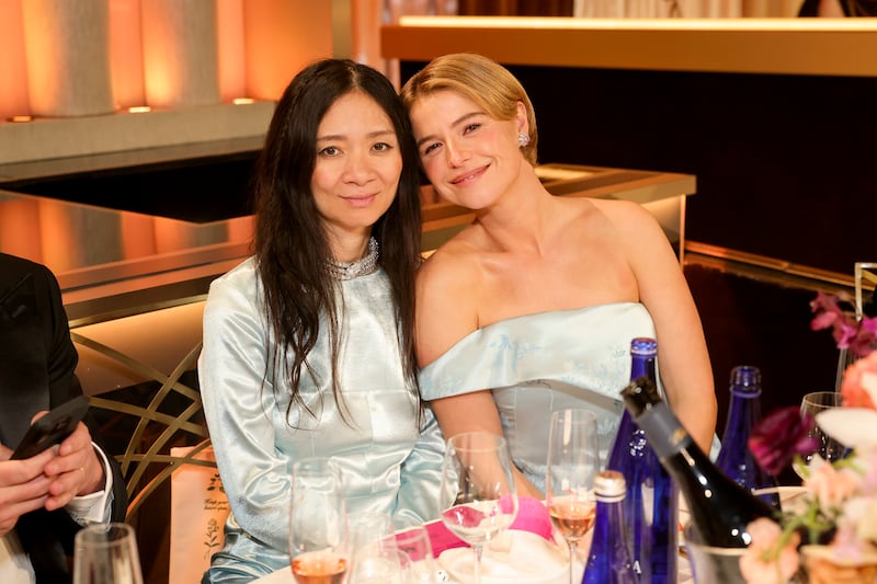Chloé Zhao and Jessie Buckley attend the 83rd Annual Golden Globe Awards