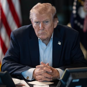 WASHINGTON DC, USA - MARCH 02: (----EDITORIAL USE ONLY â" MANDATORY CREDIT - 'THE WHITE HOUSE'S X ACCOUNT / HANDOUT' - NO MARKETING NO ADVERTISING CAMPAIGNS - DISTRIBUTED AS A SERVICE TO CLIENTS----) U.S. President Donald J. Trump sits at a table monitoring military operations during Operation Epic Fury against Iran, with U.S. flags visible behind him, in Washington, United States, on March 02, 2026. (Photo by The White House via X Account/Anadolu via Getty Images)