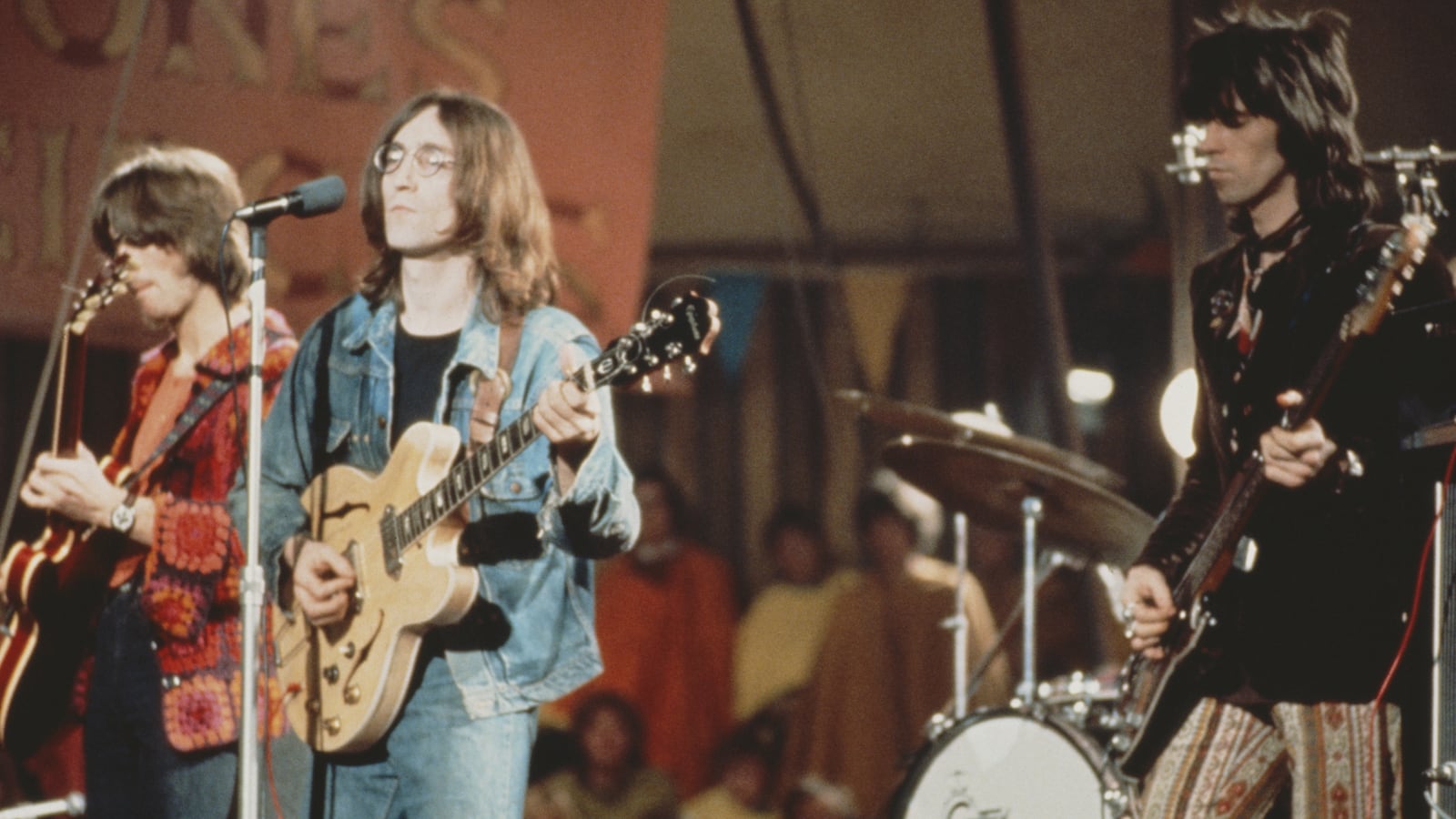 From left to right: Eric Clapton, John Lennon (1940 - 1980) and Keith Richards perform live on stage as The Dirty Mac on the set of the Rolling Stones Rock and Roll Circus at Intertel TV Studio in Wembley, London on 11th December 1968. (Photo by Mark Hayward Archive/Redferns)