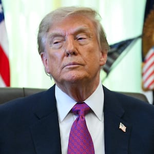 US President Donald Trump speaks after signing an executive order that aims to rename Lake Ontario to Lake America in the Oval Office of the White House in Washington, DC, on August 27, 2026. (Photo by Jim WATSON / AFP via Getty Images)