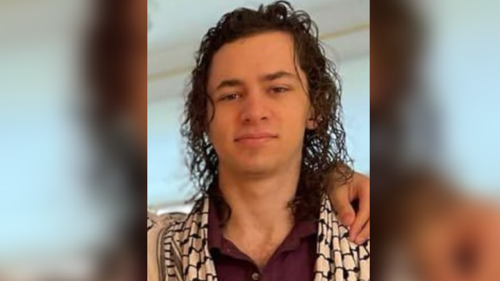 Hisham Awartani stares forward.