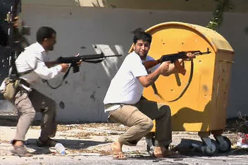 galleries/2011/08/21/libya-rebels-take-tripoli-capture-gaddafi-sons-photos/libyan-rebels7_qq8kyl