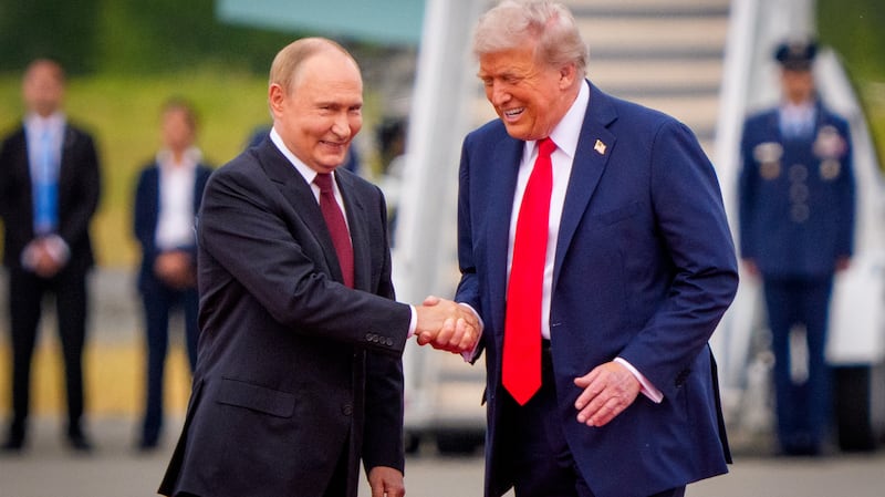 U.S. President Donald Trump (R) greets Russian President Vladimir Putin as he arrives at Joint Base Elmendorf-Richardson on August 15, 2025 in Anchorage, Alaska.