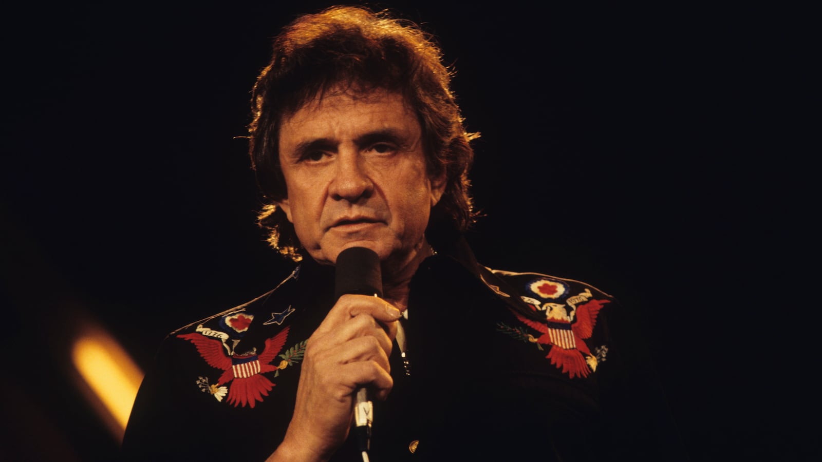 LONDON, UNITED KINGDOM - MARCH 31 : American singer Johnny Cash performs on stage at the Country Music Festival held at Wembley Arena, London on March 31, 1986.