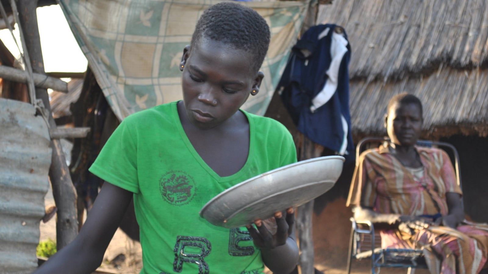 articles/2012/04/06/in-south-sudan-girls-are-given-away-to-settle-family-feuds/atia-odongi-rhodes-teaser_c8pnks