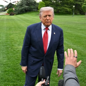 US President Donald Trump speaks to journalists as he makes his way to board Marine One before departing from the South Lawn of the Wxhite House in Washington, DC on May 8, 2026. Trump is traveling to Sterling, Virginia, where he will participate in a LIV Golf dinner. (Photo by Mandel NGAN / AFP via Getty Images)