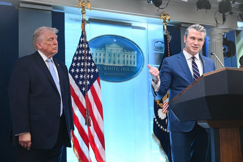 US President Donald Trump looks on as US Secretary of Defense Pete Hegseth speaks about the conflict in Iran this week. Photo by SAUL LOEB / AFP via Getty Images.