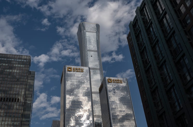 BEIJING, CHINA - JUNE 27: The Citic Tower, or China Zun, showing damage in the upper center is seen after it was struck by a small aircraft, early on June 27, 2026 in Beijing, China. Authorities confirmed Saturday afternoon that on Friday evening a small aircraft crashed into the building killing the lone pilot and injuring thirteen people on the ground. The building, which is 109 stories tall, is the 10th largest building in the world. (Photo by Kevin Frayer/Getty Images)