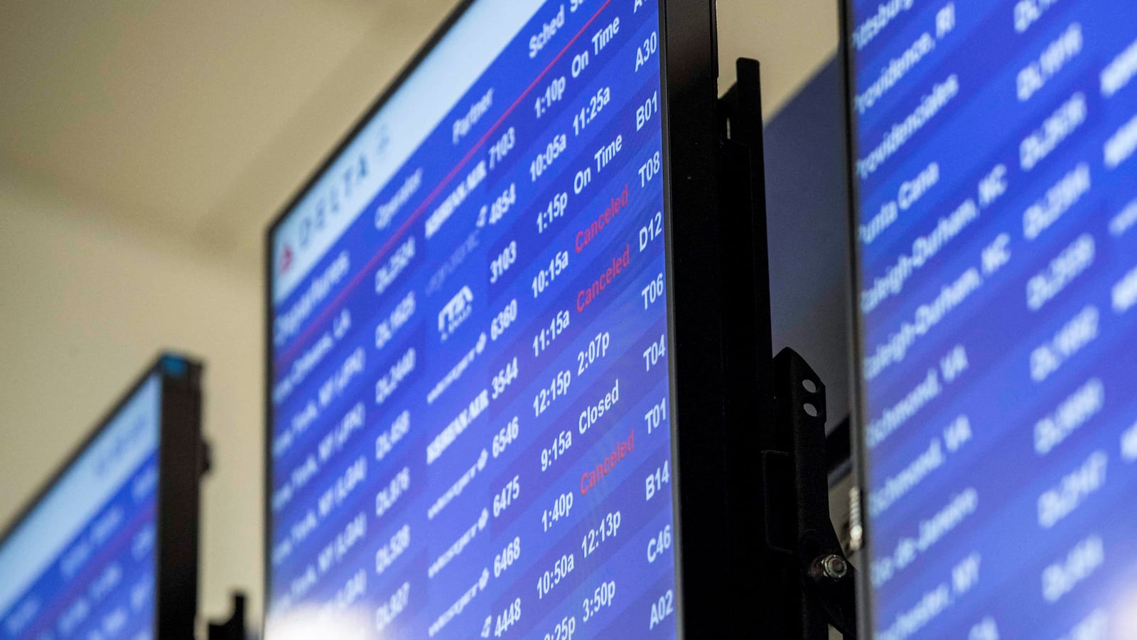 Status of flights are displayed at Hartsfield-Jackson Atlanta International Airport