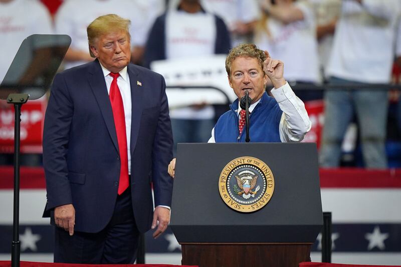 U.S. President Donald Trump looks on as Sen. Rand Paul (R-KY) speaks at a campaign rally