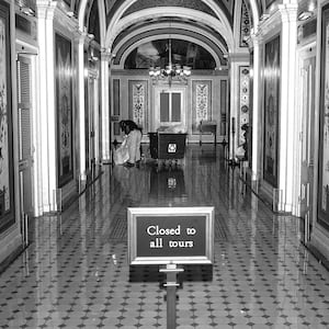 Architect of the Capitol workers are seen just after midnight at the U.S. Capitol on October 1, 2025 in Washington, DC.