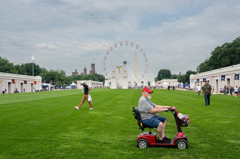 WASHINGTON, DC - JUNE 26: Visitors inspect the exhibitions at the Great American State Fair on June 26, 2026 in Washington, DC. The Freedom 250-backed Great American State Fair celebrating the 250th anniversary of the United States runs through July 10th. (Photo by Andrew Leyden/Getty Images)