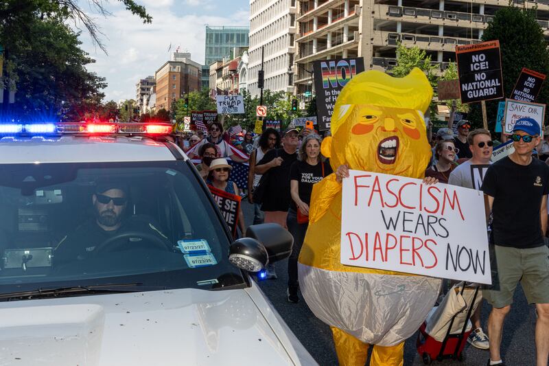WASHINGTON, DC - AUGUST 16: Protestors rally at Dupont Circle before marching to the White House on August 16, 2025 in Washington, DC. Demonstrators took to the streets against an increased presence of law enforcement throughout the nation's capital after U.S. President Donald Trump deployed federal officers and the U.S. National Guard. (Photo by Alex Kent/Getty Images)