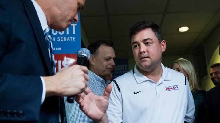 Christian Ziegler walks through a crowd at a political rally in 2018.