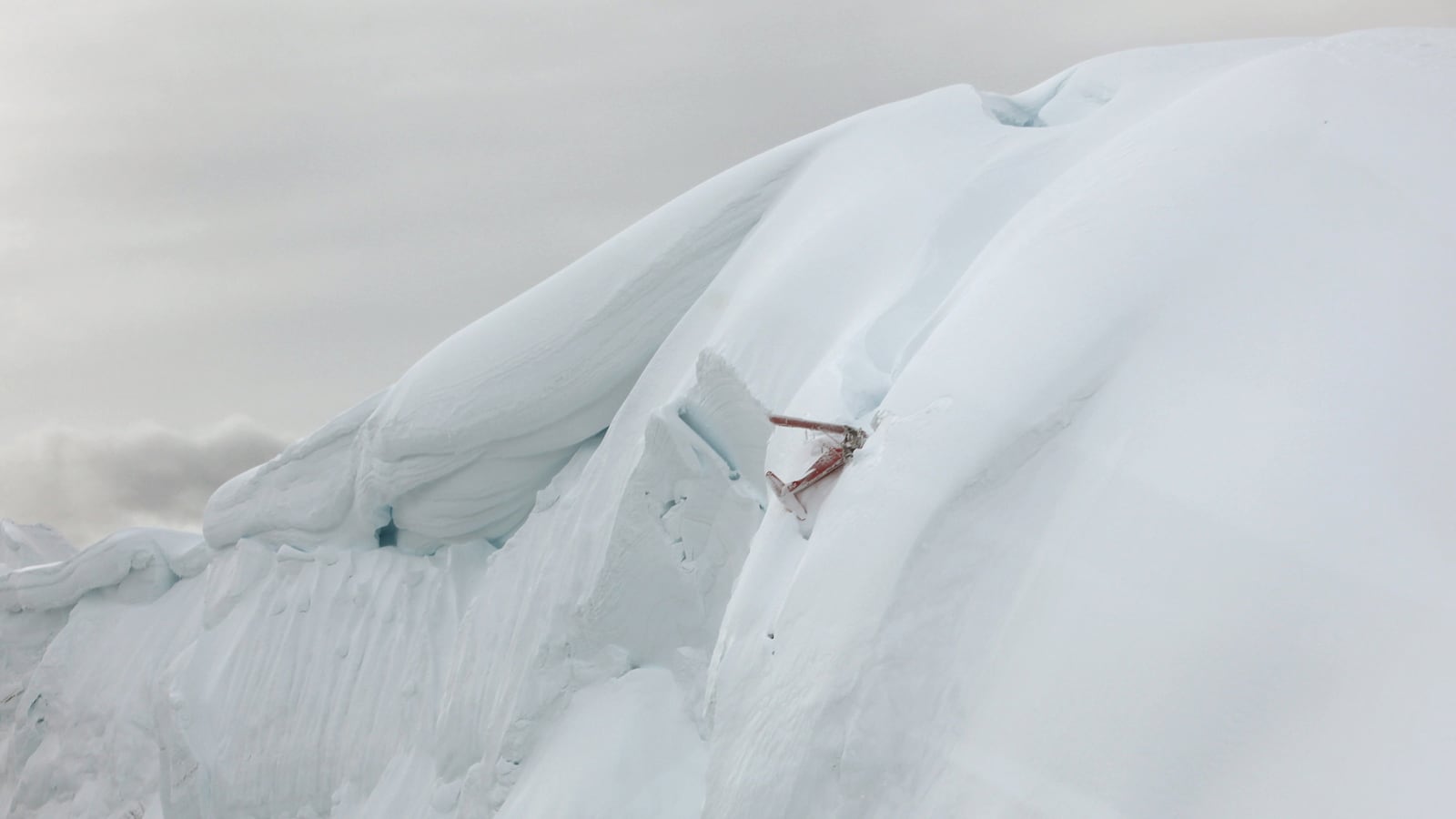 The wreckage of a sightseeing plane that crashed near the summit of one of the mountains in Denali National Park in this National Park Service image in Alaska.