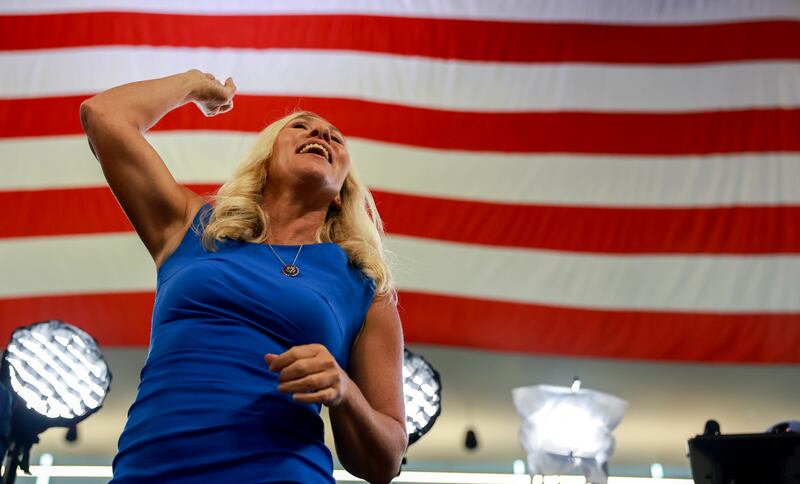 Rep. Marjorie Taylor Greene (R-GA) gestures to the crowd before the start of a campaign rally with Republican presidential nominee, former President Donald Trump, at the Georgia State University Convocation Center on August 3, 2024 in Atlanta, Georgia.
