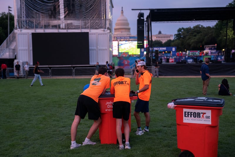 Crew members take a break during the Great American State Fair on the National Mall in Washington, D.C., U.S., June 25, 2026. REUTERS/Nathan Howard