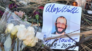 TOPSHOT - Flowers are left at a makeshift memorial in the area where Alex Pretti was shot dead a day earlier by federal immigration agents in Minneapolis, Minnesota, on January 25, 2026. On January 24, federal agents shot dead US citizen Alex Pretti, a 37-year-old ICU nurse, while scuffling with him on an icy roadway, less than three weeks after an immigration officer shot and killed Renee Good, also 37, in her car.
His killing sparked new protests and impassioned demands by local leaders for the Trump administration to end its operation in the city. (Photo by Octavio JONES / AFP via Getty Images)