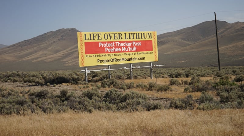 Photo taken on July 2, 2022 shows a sign against the proposed lithium clay mining development project, one of the largest in the world, by the side of the road to the project in Humboldt County, Nevada, the United States. The planned Thacker Pass lithium mine in the remote north of U.S. state of Nevada, the largest known lithium deposit in the United States, has drawn concerns and protests from environmental groups, Native American tribes and local ranchers.