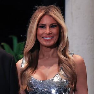 PALM BEACH, FLORIDA - DECEMBER 31: U.S. President Donald Trump and first lady Melania Trump arrive for a New Year’s Eve event at his Mar-a-Lago home on December 31, 2025 in Palm Beach, Florida. The president addressed guests and celebrated the arrival of 2026. (Photo by Joe Raedle/Getty Images)
