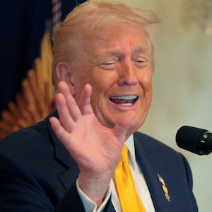 President Donald Trump talks about Nicki Minaj's "beautiful" skin and long nails at a Black History Month reception in the East Room of the White House on February 18, 2026.