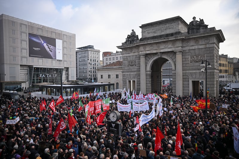 People take part in a demonstration against US Immigration and Customs Enforcement (ICE) ahead of the Milano Cortina 2026 Olympic Games in Milan.