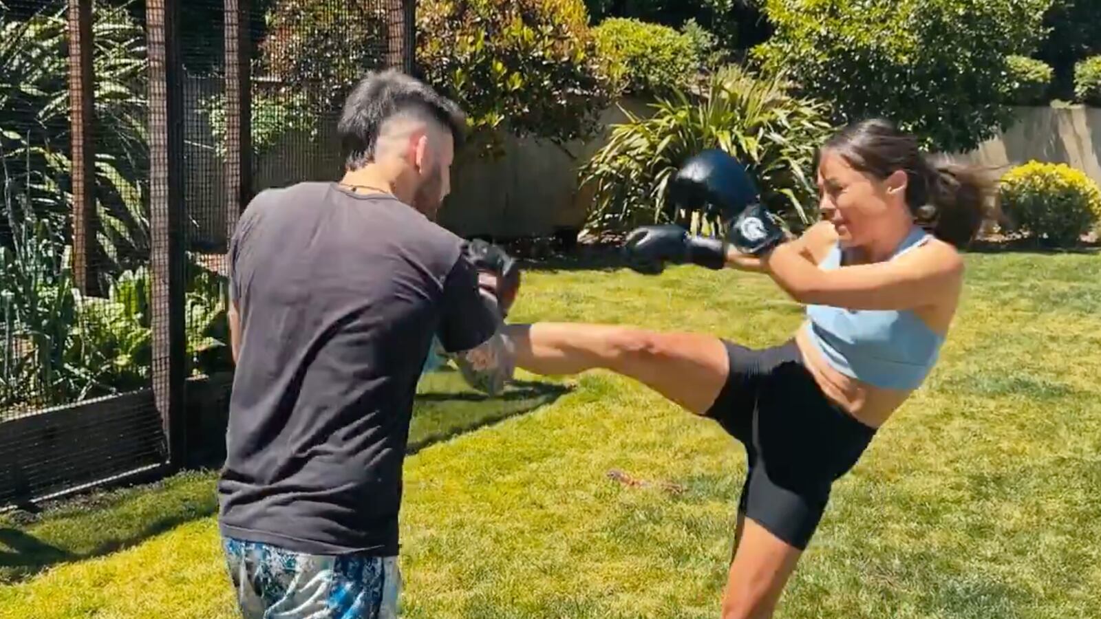 Nicole Shanahan kick boxing with a sparring partner