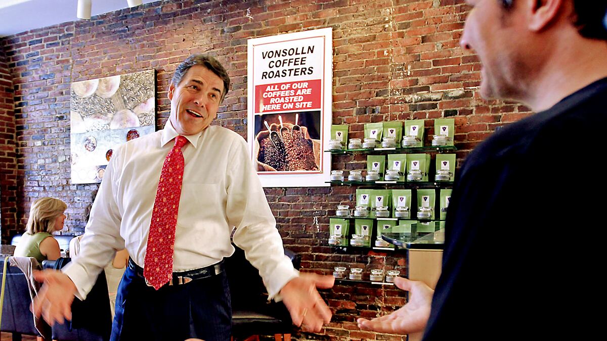 cheats/2011/08/18/perry-heckled-over-climate-change/rick-perry-protestors-new-hampshire-cheat_nbldjv