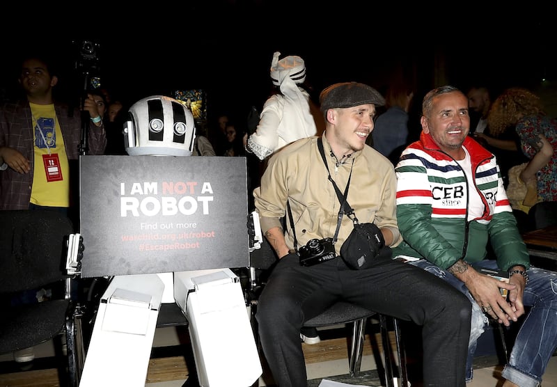 Brooklyn Beckham and DJ Fat Tony attend the Pam Hogg Show during London Fashion Week September 2018 at Freemasons Hall on September 14, 2018 in London, England.