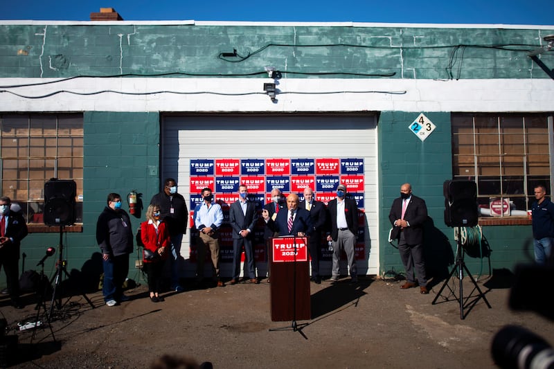 Former New York Mayor Rudy Giuliani addresses the media with the Trump legal team after news media named Democratic presidential nominee Joe Biden the winner in the 2020 U.S. presidential election, at Four Seasons Landscaping company in Philadelphia